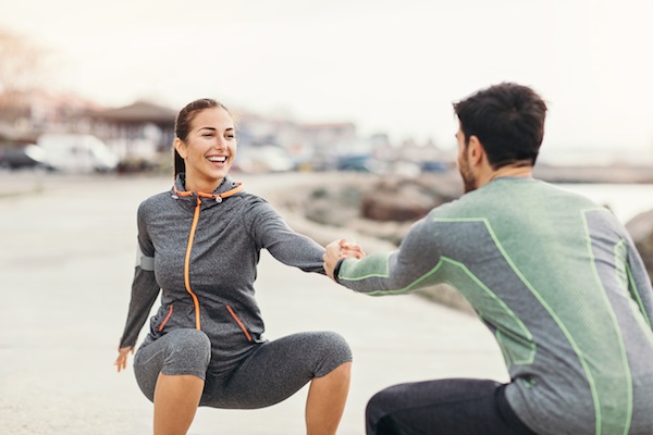 Exercising together outdoors in early morning